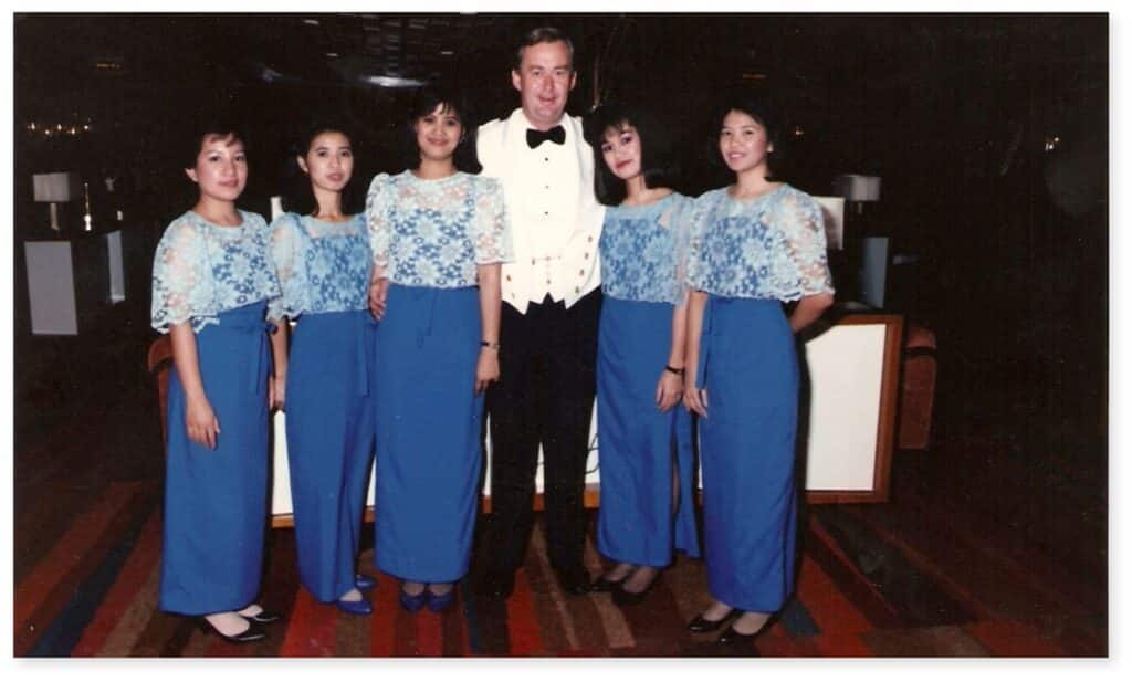 Group of bar stewardesses aboard Rotterdam with ship's chief officer