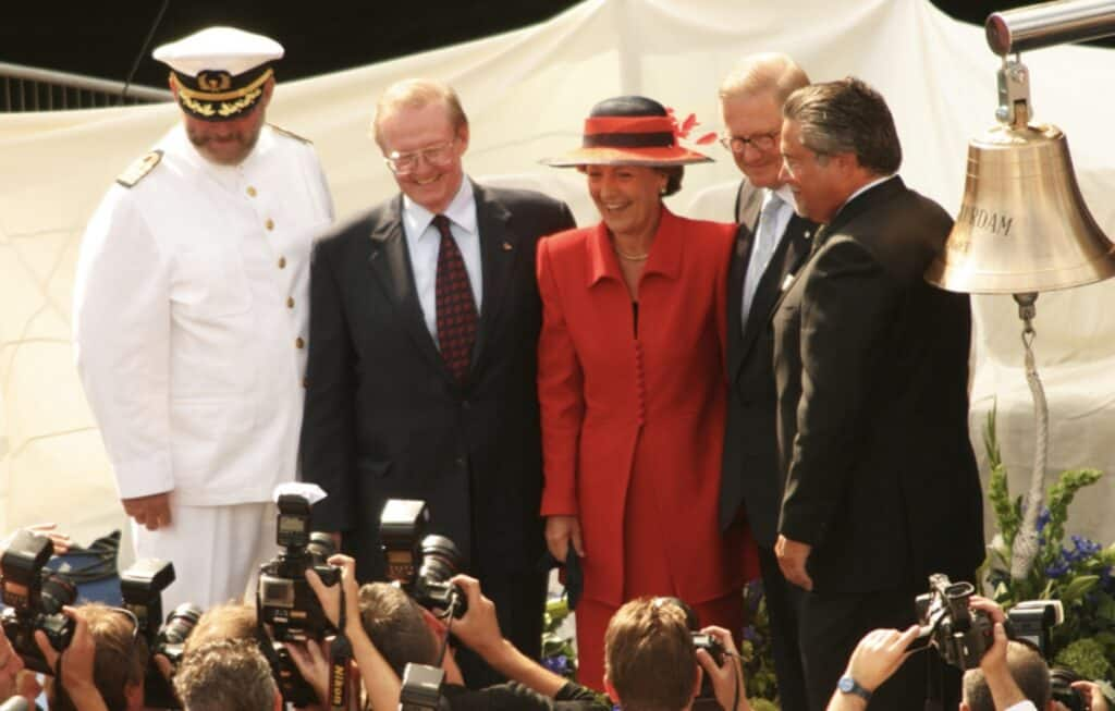 Her Royal Highness Princess Margriet of the Netherlands at the Blessing of the Bell ceremony, with crew and dignitaries being photographed by news crews