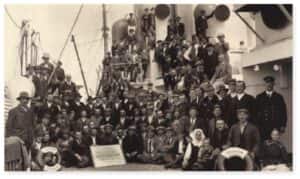 Immigrants board a Holland America Line ship, heading to Ellis Island