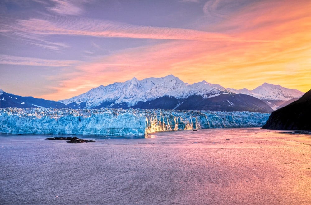 Sunrise at Hubbard Glacier with mountain in Alaska.