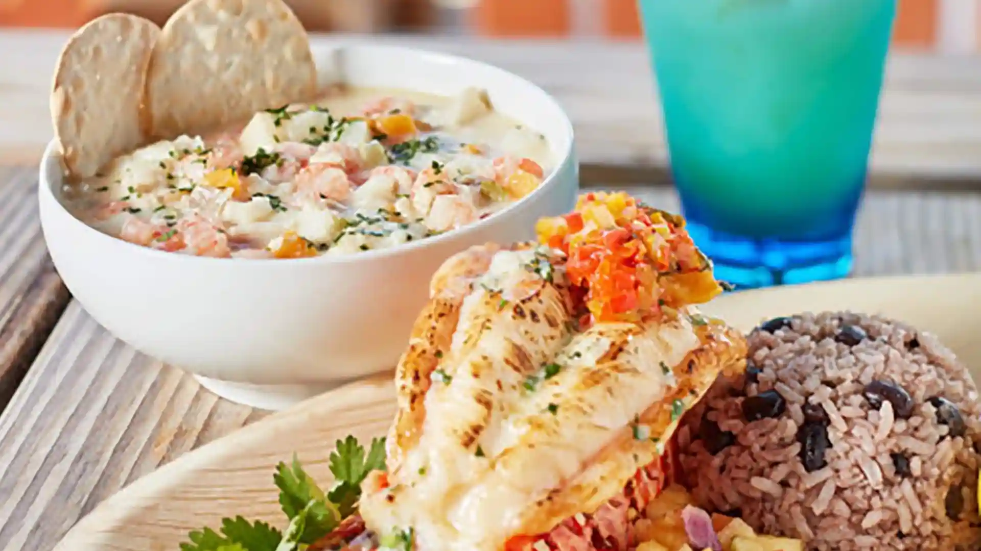 Caribbean Cruise Cuisine View of lobster, rice, soup and cocktail.