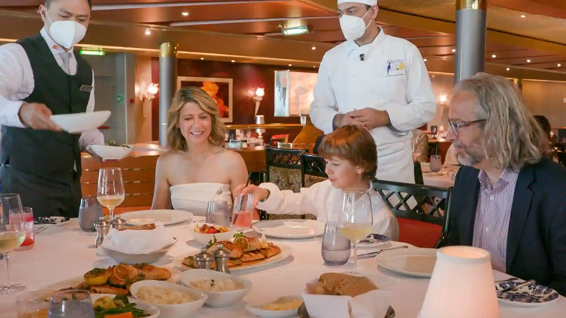 Samantha Brown in Holland America Line Dining Room Travel expert Samantha Brown and family in dining room on Holland America Line cruise ship.