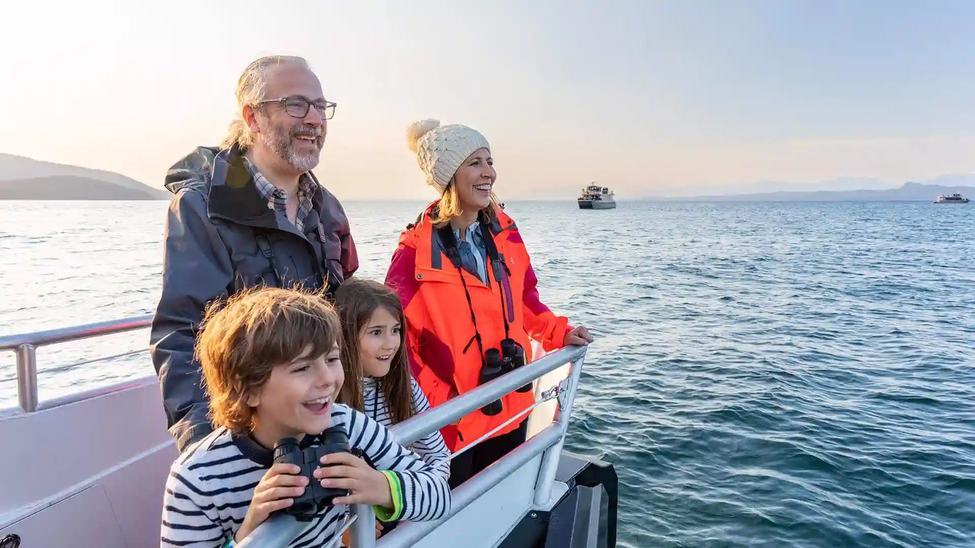 Travel expert Samantha Brown with family on whale watching shore excursion.