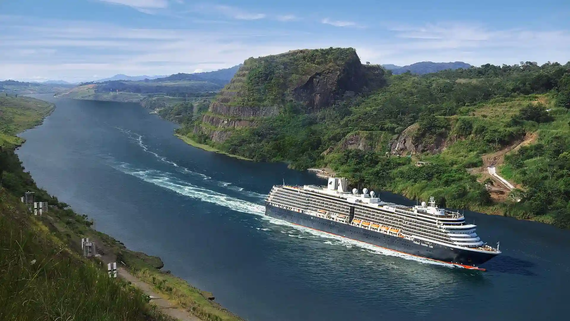 View of Holland America Line cruise ship sailing the Panama Canal.