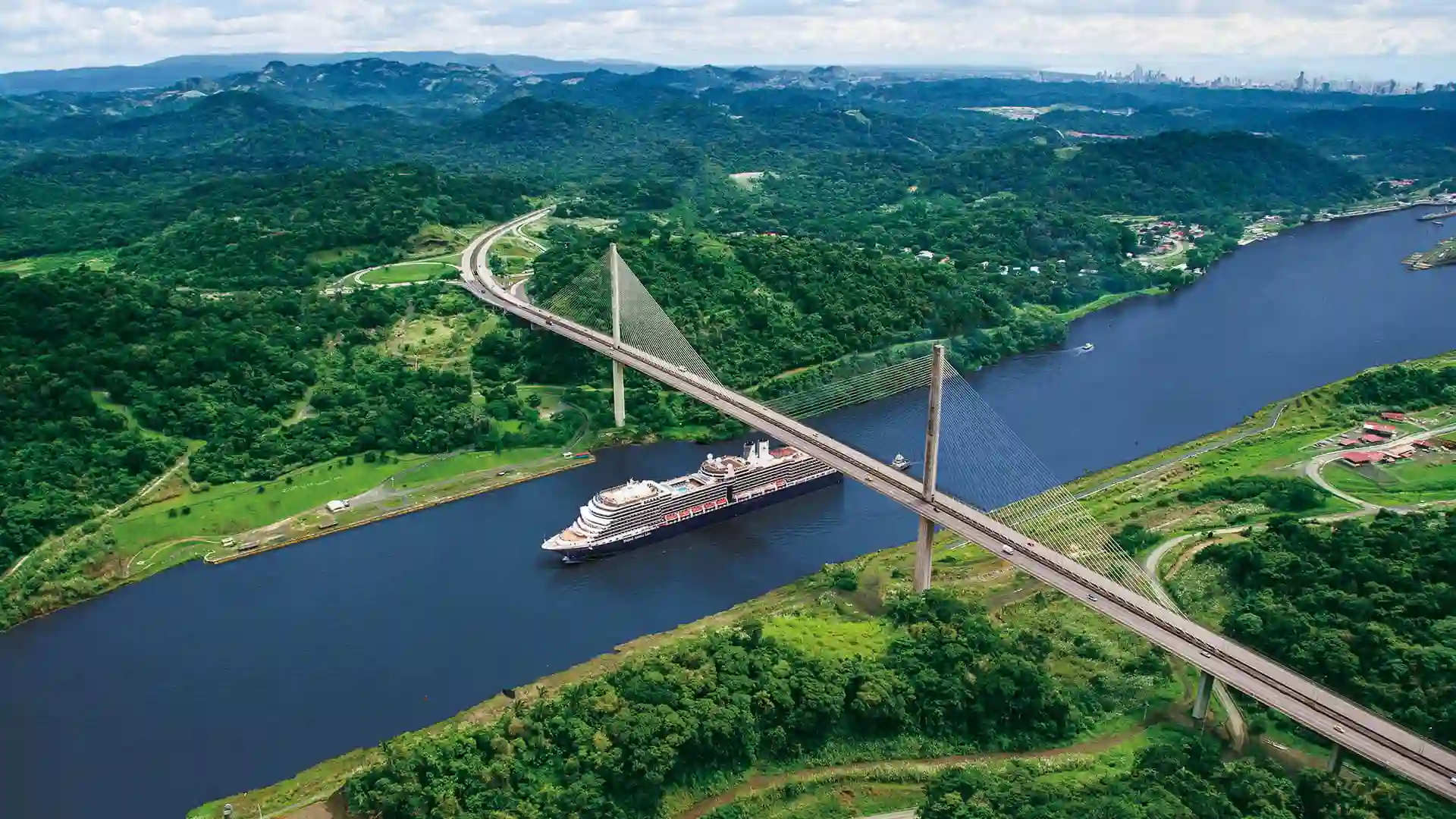 View of Holland America Line cruise ship sailing the Panama Canal.