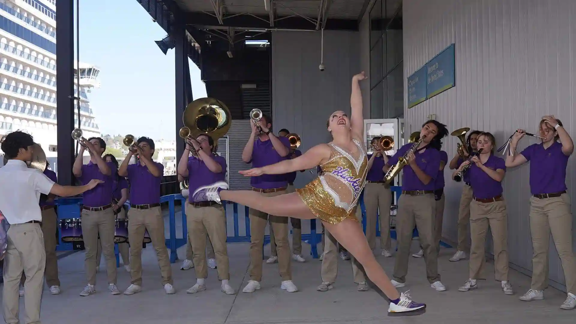 View of University of Washington band performing at Port of Seattle for Holland America Line event.