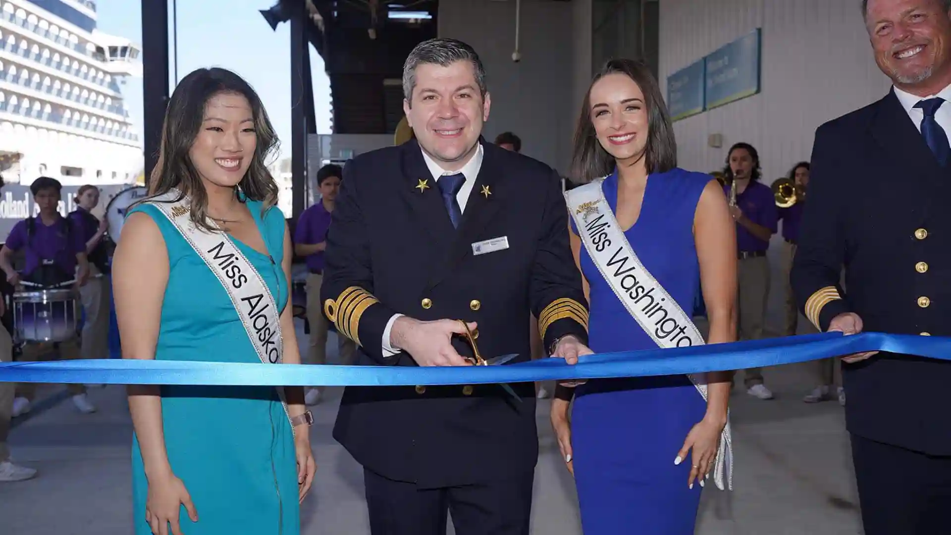 View of people at ribbon-cutting ceremony for Holland America Line's Alaska season kick-off event.