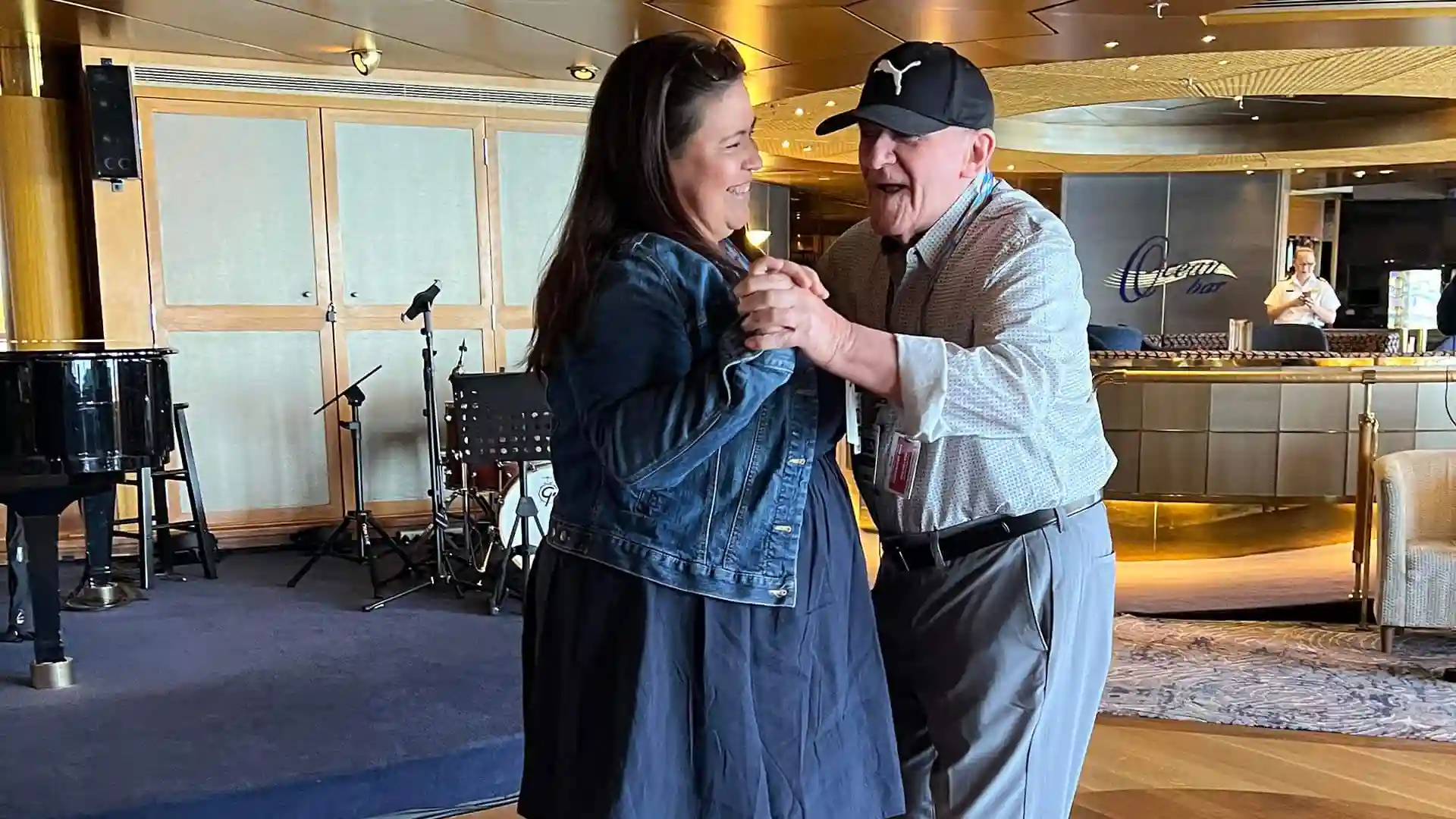 Father and daughter dancing on Holland America Line cruise ship.