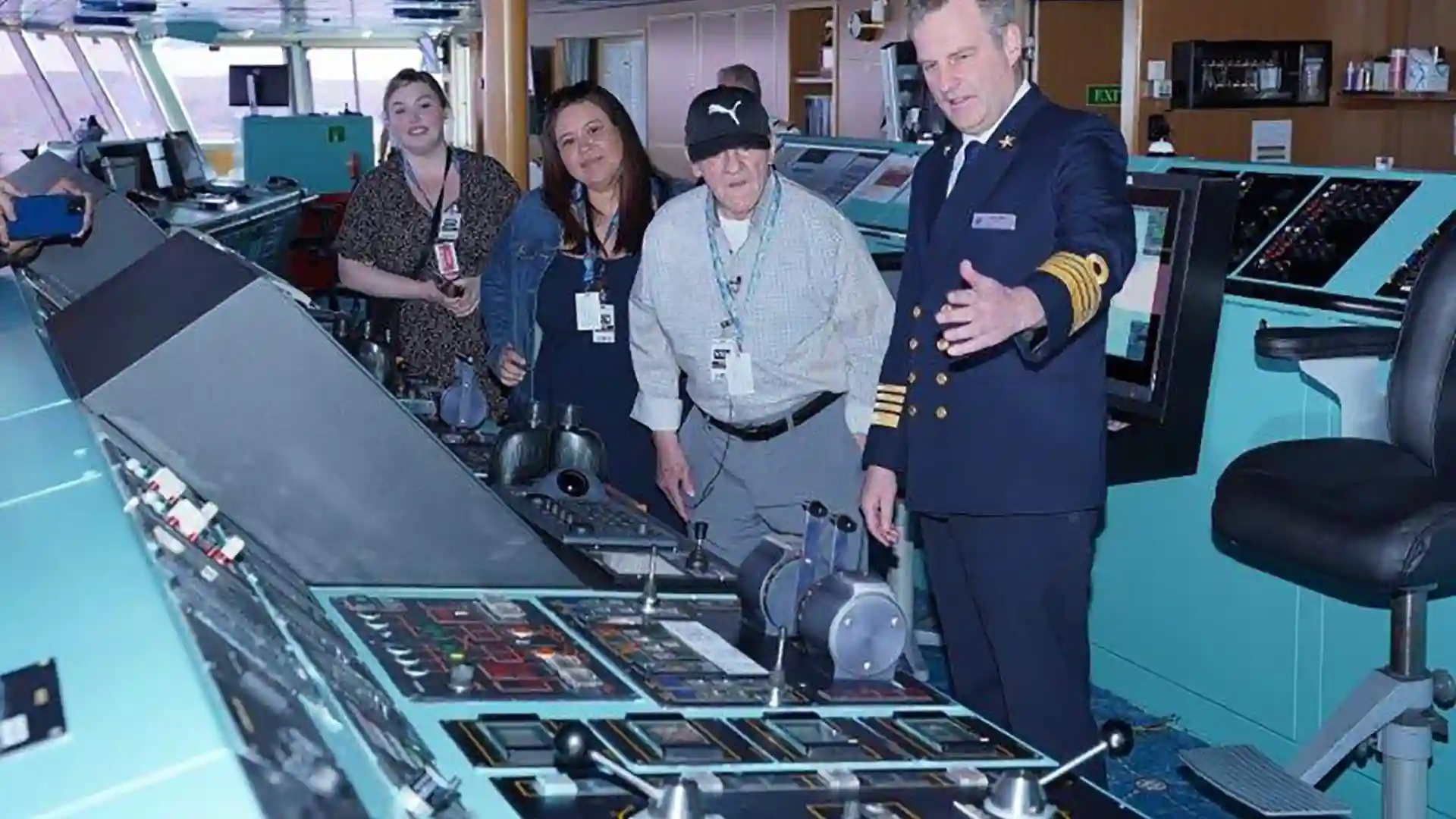 View of people touring bridge of Holland America Line cruise ship.