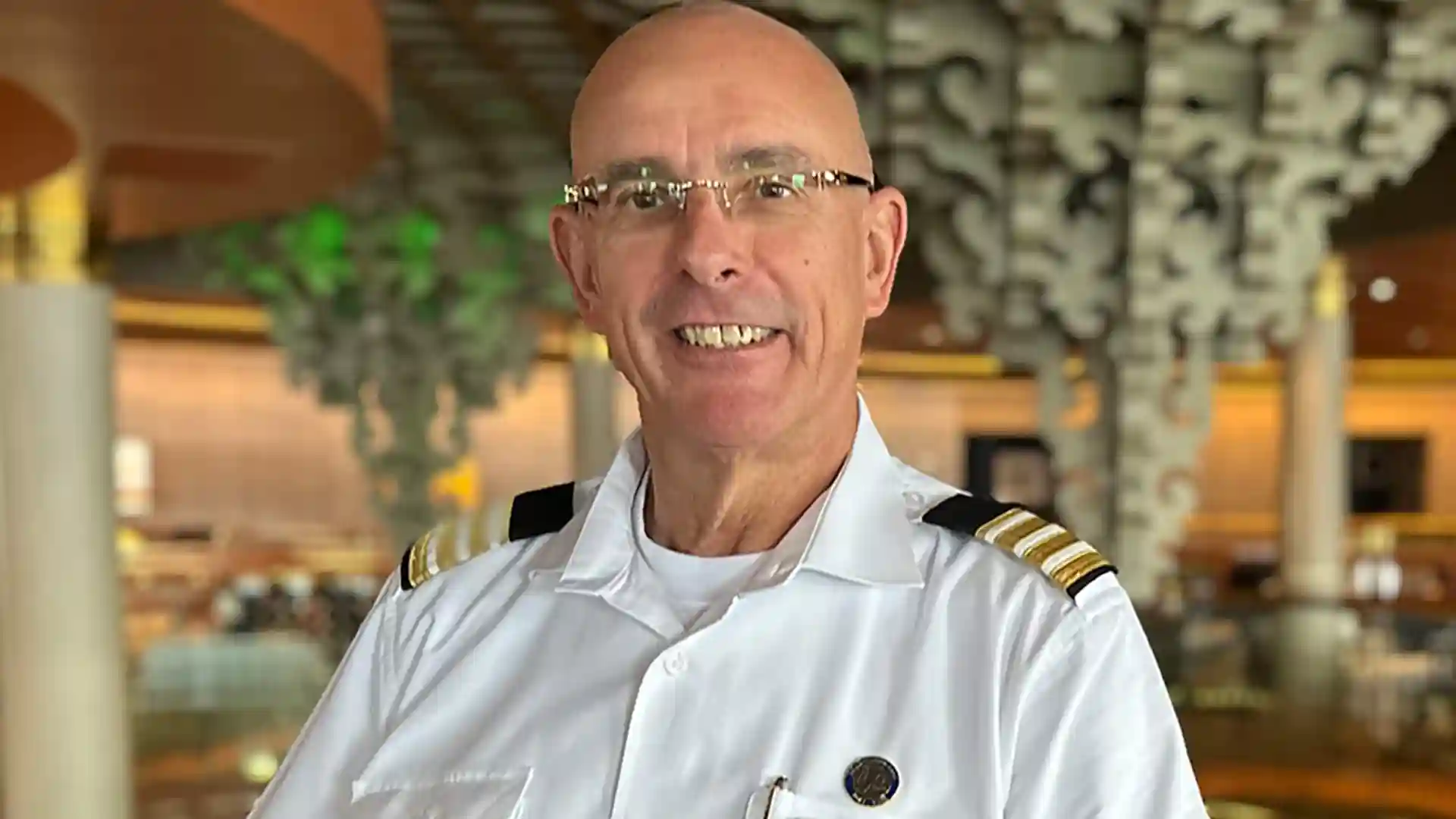 Holland America Line Food & Beverage Director Holland America Line Food & Beverage Director with dining room in background.