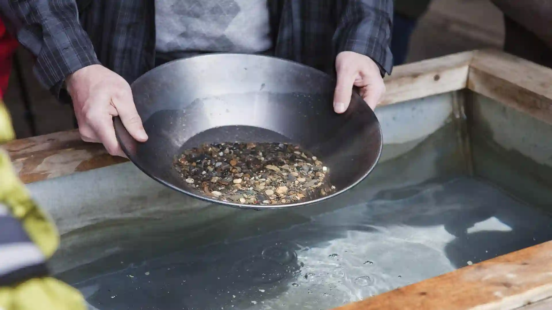 View of person panning for gold.