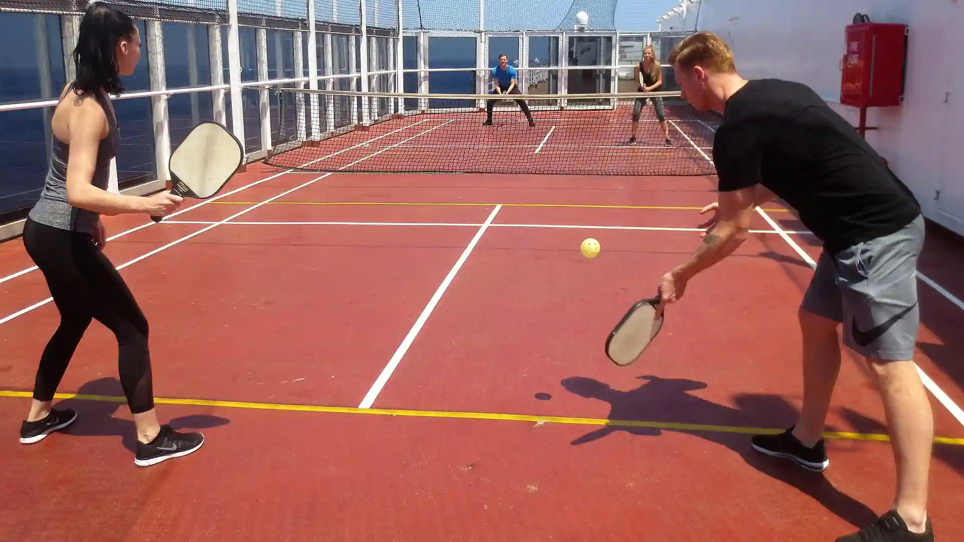 People playing pickleball on Holland America Line cruise ship.