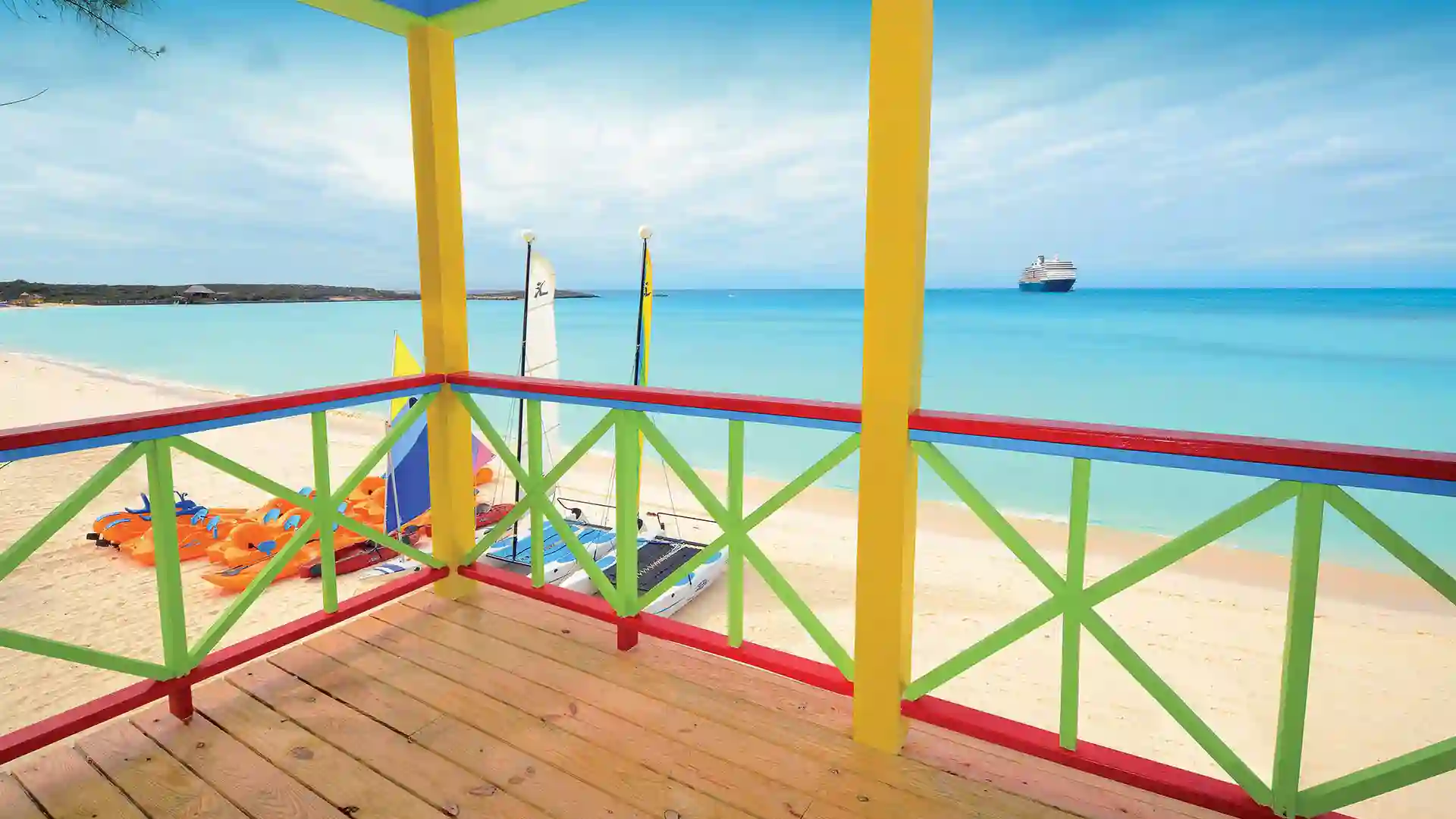 Half Moon Cay Villa View of ocean and cruise ship from colorful beach villa.