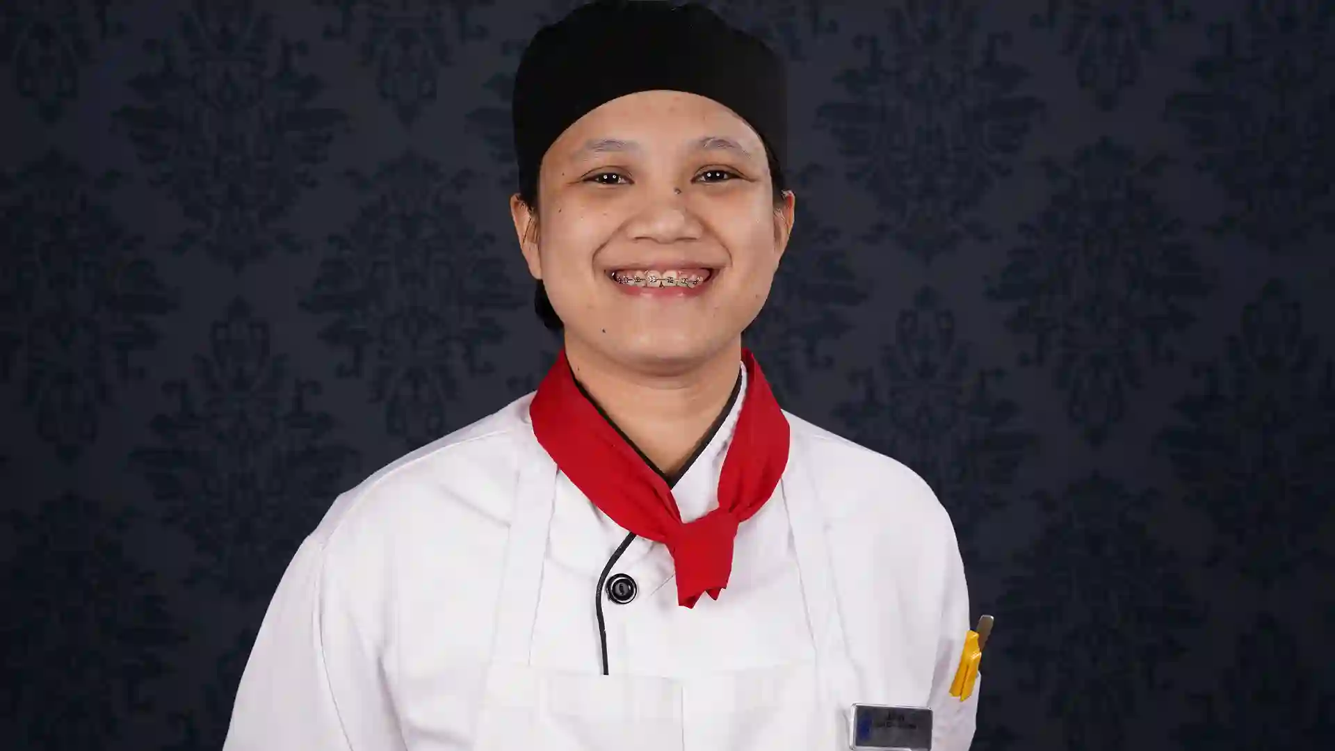 Demi Chef De Partie Customer Service Week Person in white chef jacket.