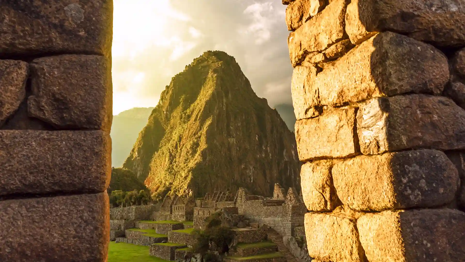 View of Machu Picchu, an ancient citadel surrounded by a lush green landscape in South America.