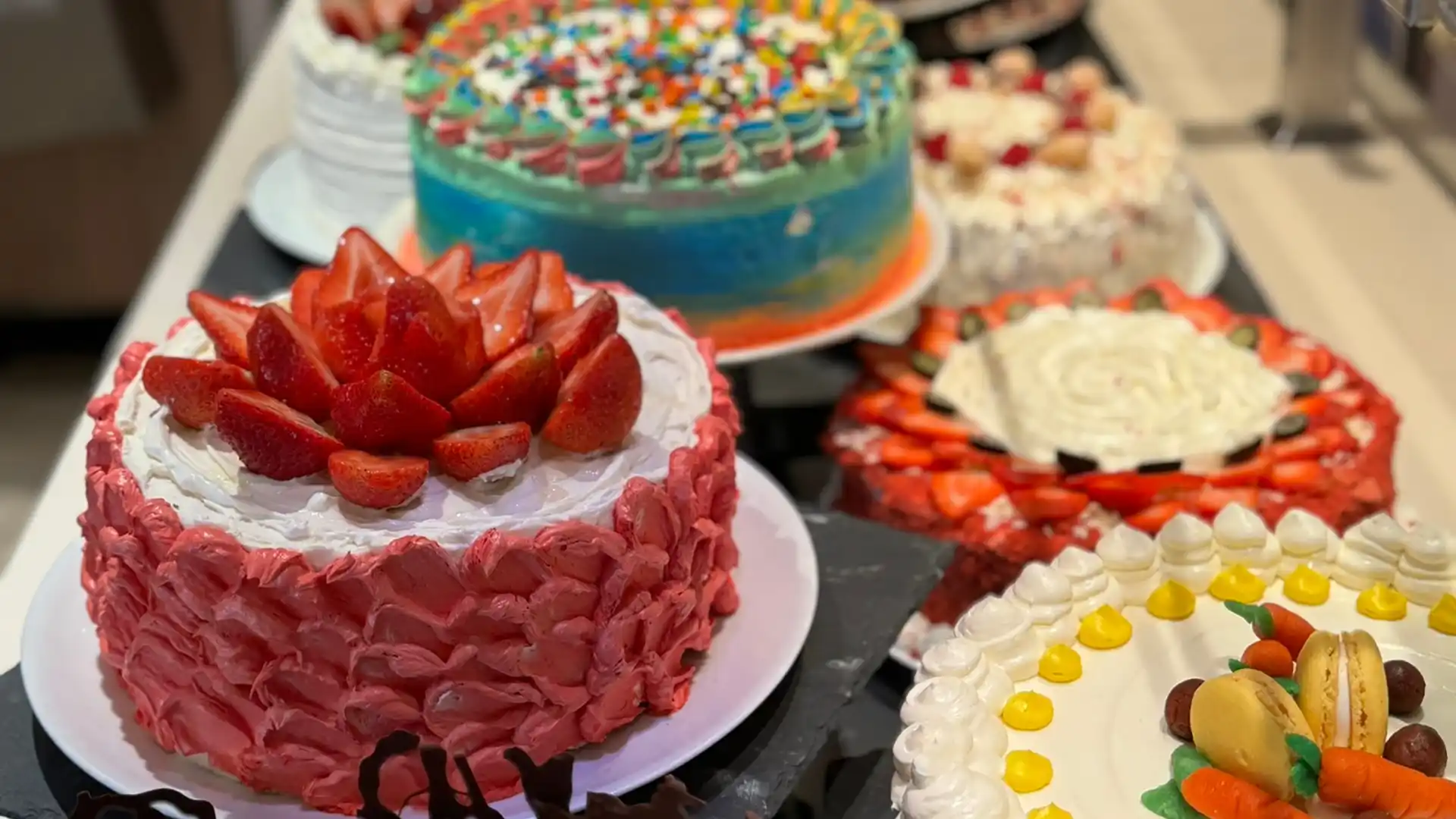 Cake Me Away Holland America Line View of Holland America Line cakes at Lido Market.