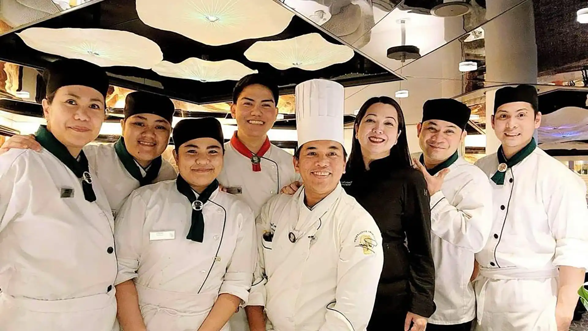 Holland America Line pastry crew in uniform with executive pastry chef.