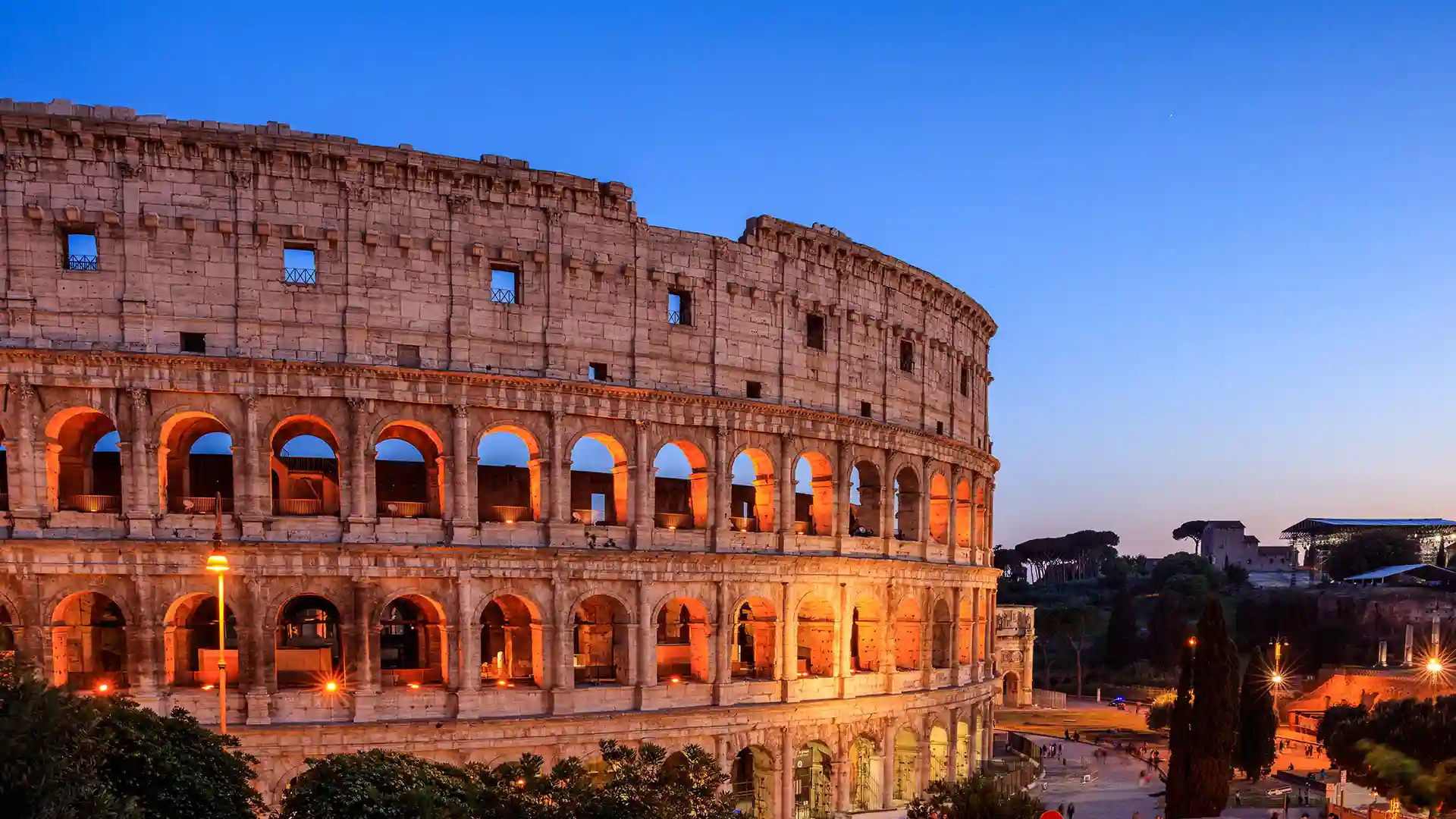 Lights reflect off Rome's colosseum in Italy.