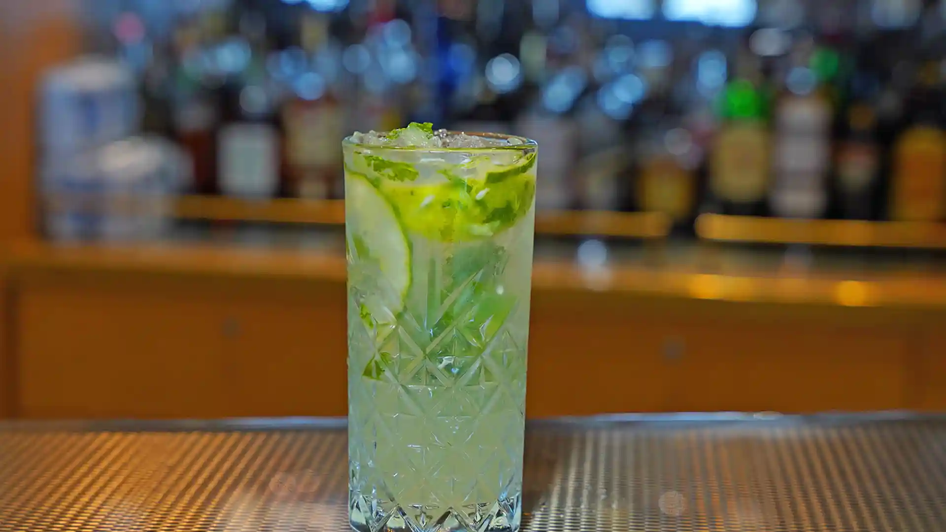 Mocktail in drinking glass featuring cucumber flavors.