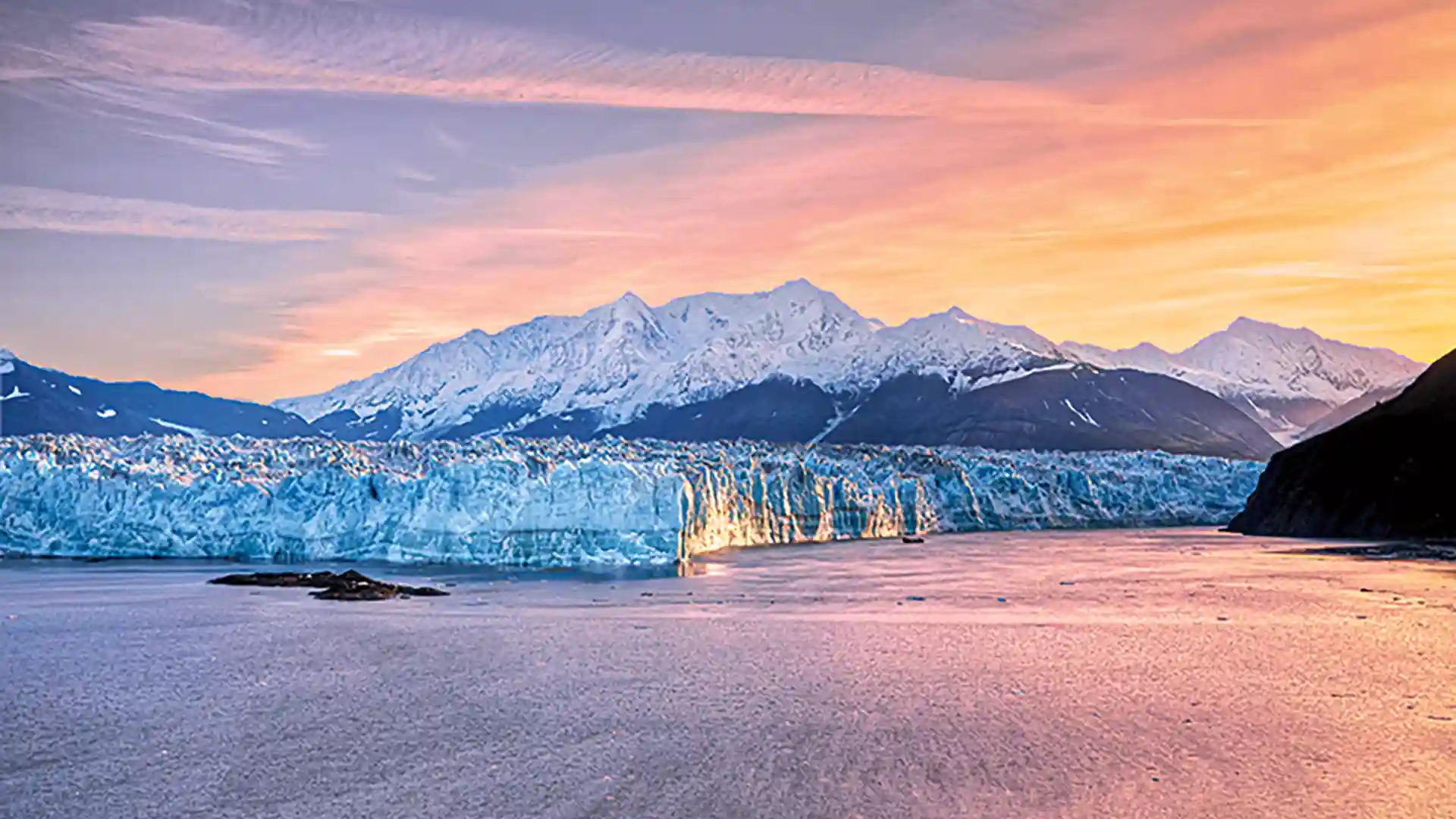 View of midnight sun highlighting Alaska glaciers.