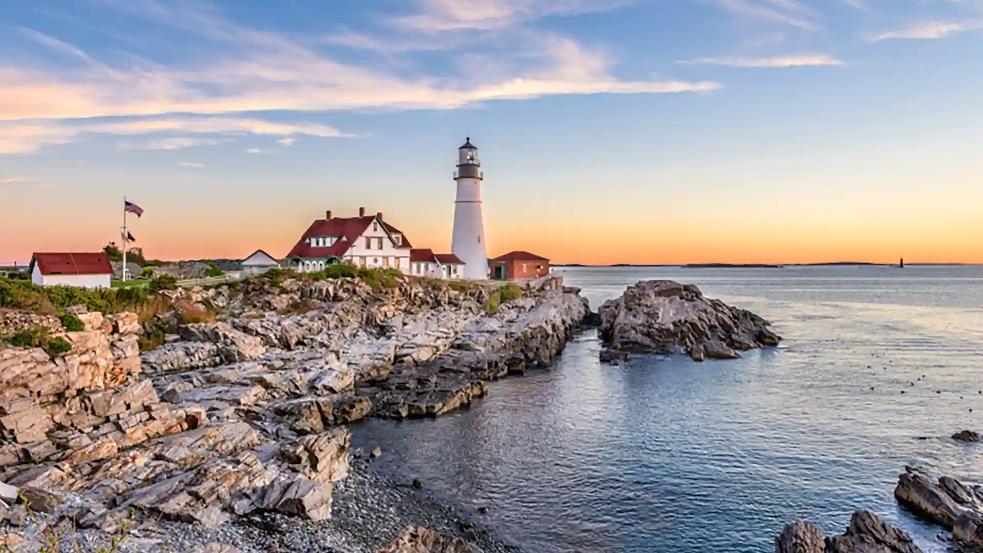 Canada New England Cruise Vacation View of lighthouse overlooking the rocky coast of New England.