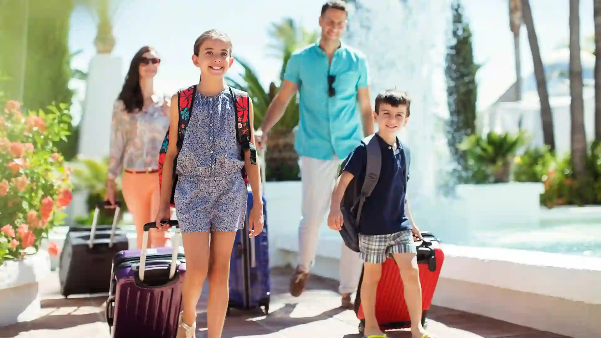 View of people walking with luggage on vacation.