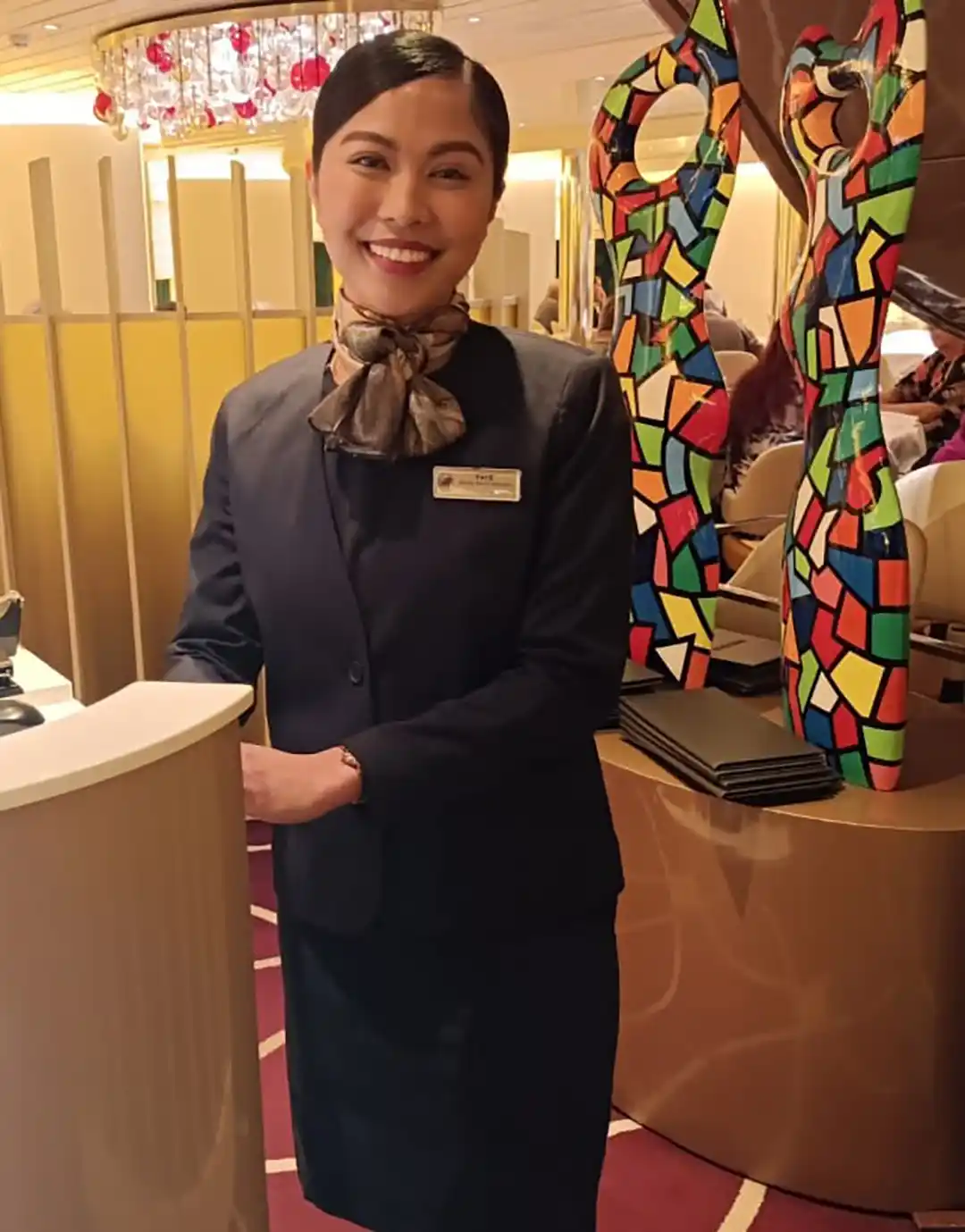 Holland America Line Crew Member View of Holland America Line crew member standing outside dining area.