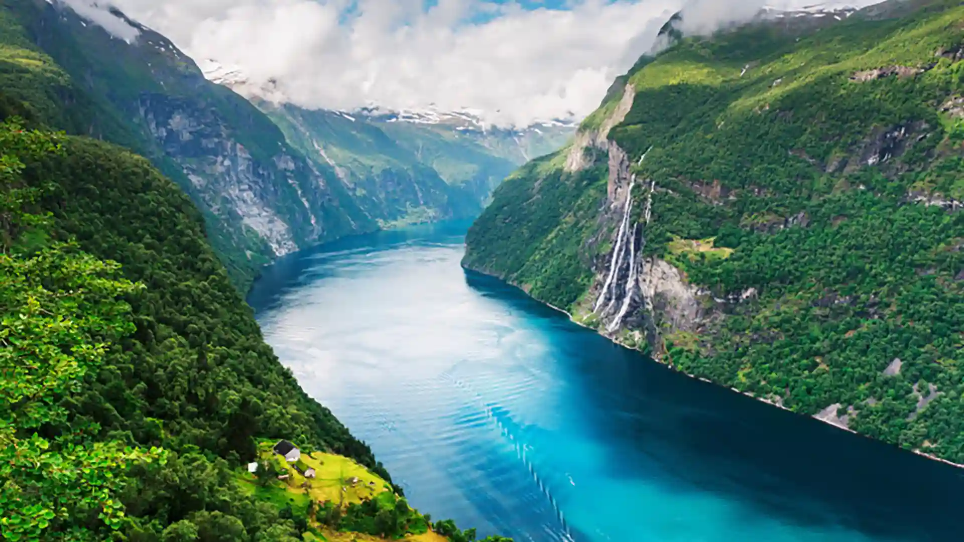 Geirangerfjord in Norway View of Norway's Geirangerfjord, a UNESCO World Heritage Site, below cloudy skies.