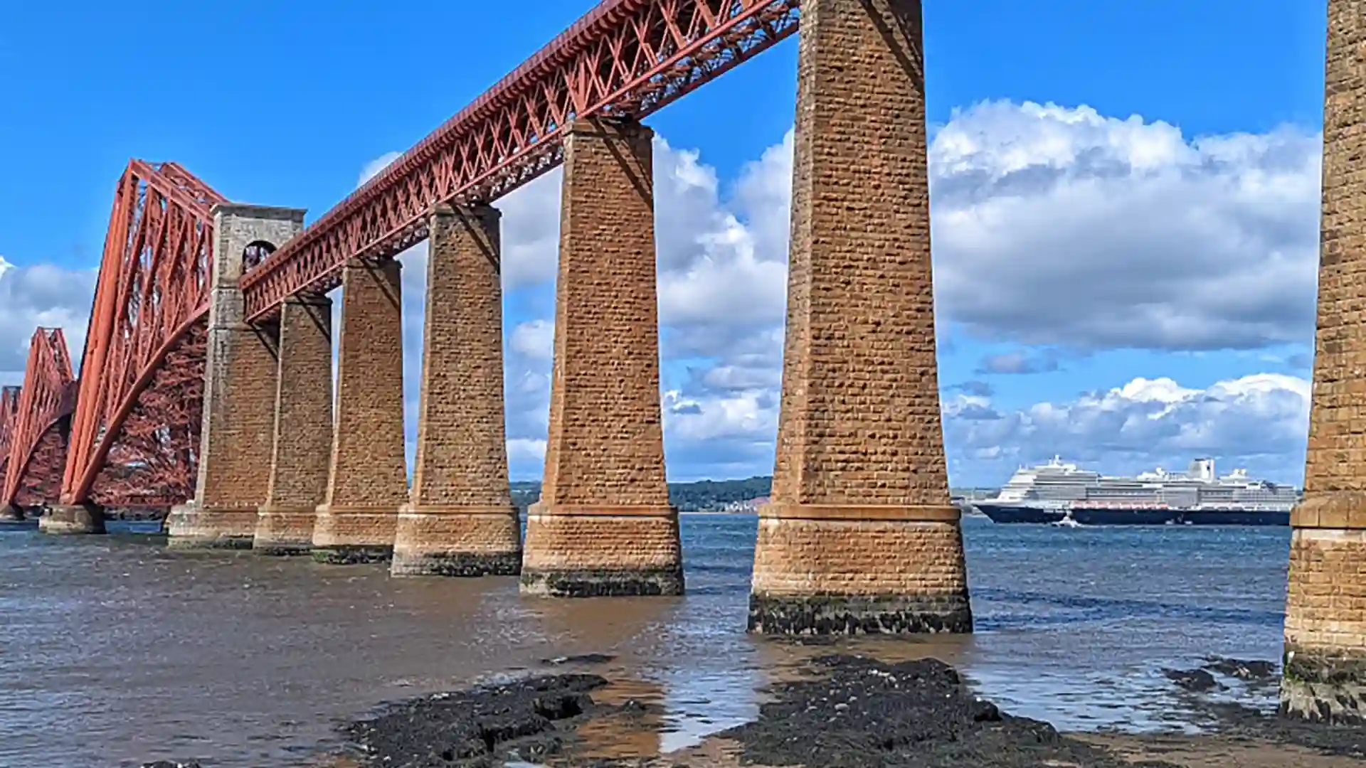 Forth Bridge in Scotland View of Scotland's Forth Bridge, a UNESCO World Heritage Site, with Holland America Line cruise ship in background.