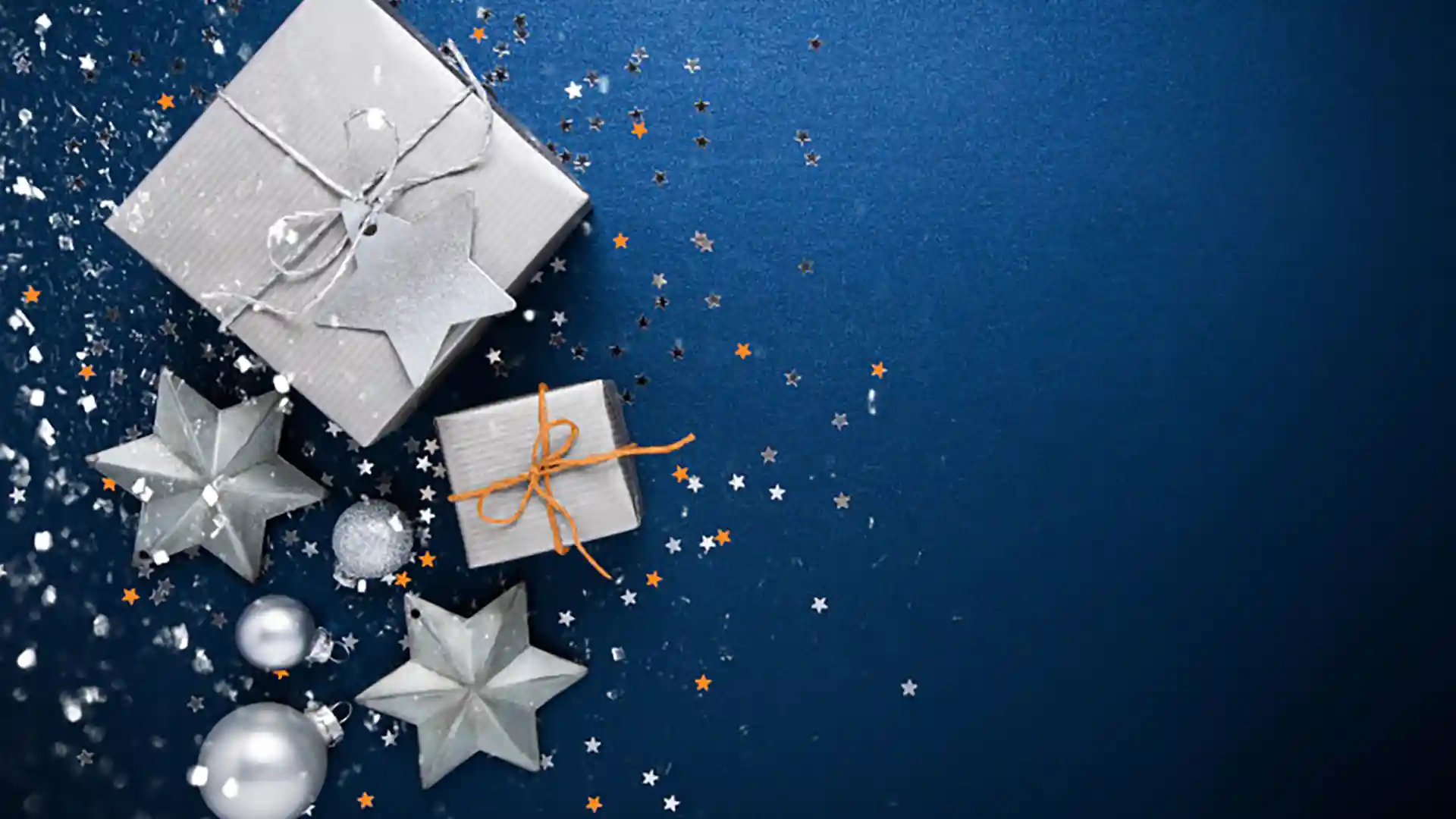 Holiday Gift Shopping Wrapped gift packages with bows on blue background.