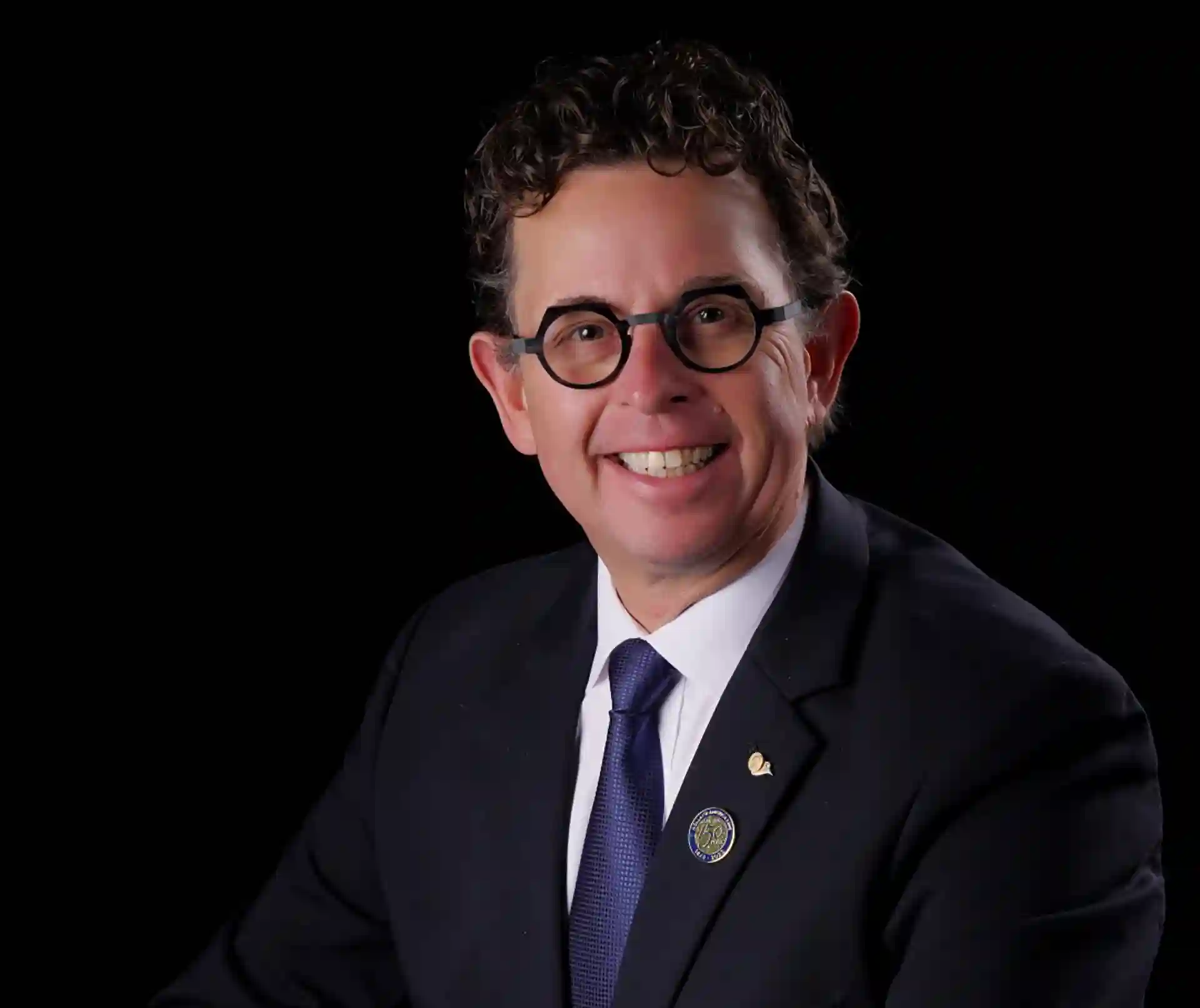 Holland America Line Hotel General Manager Portrait of Holland America Line General Hotel Manager in front of black background.