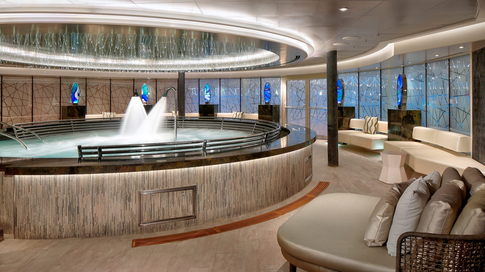 The large Hydropool with two spraying showers inside the Spa & Salon on Holland America cruise ships.