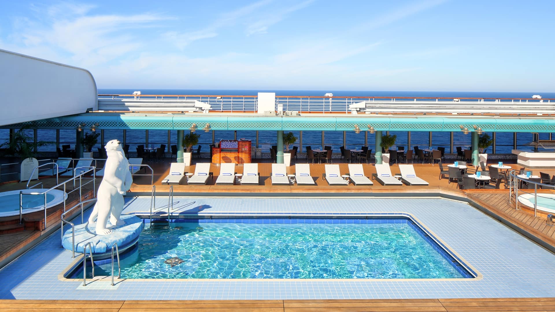 The Lido Pool and lounge chairs on a Holland America cruise ship as seen from the side.