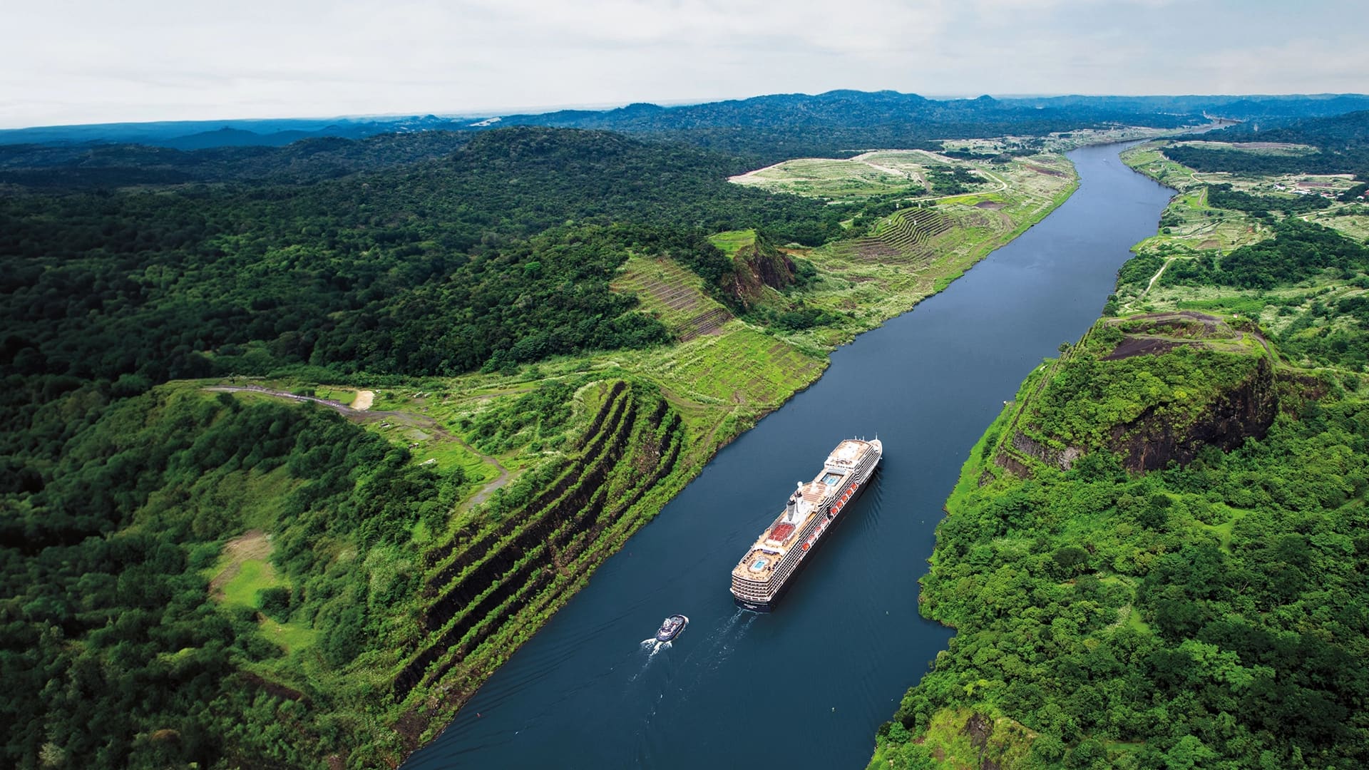 A smaller Holland America cruise ship moving through the Panama Canal.