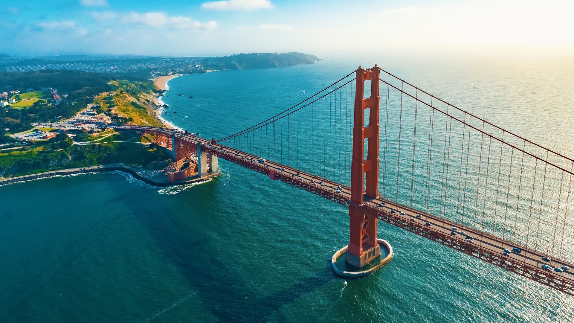 The Golden Gate bridge stretching over turquoise water