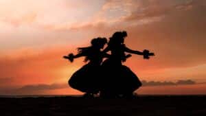 ideal-cruise-lenght-blog-2 Silhouetted hula dancers at sunset on the beach.
