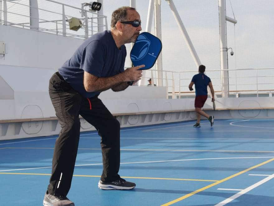 guests playing pickleball on cruise sport courts