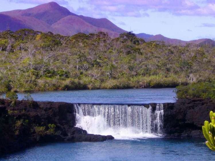 A view of a waterfall in Kuto, Ile Des Pins, New Caledonia on a Tahiti cruise