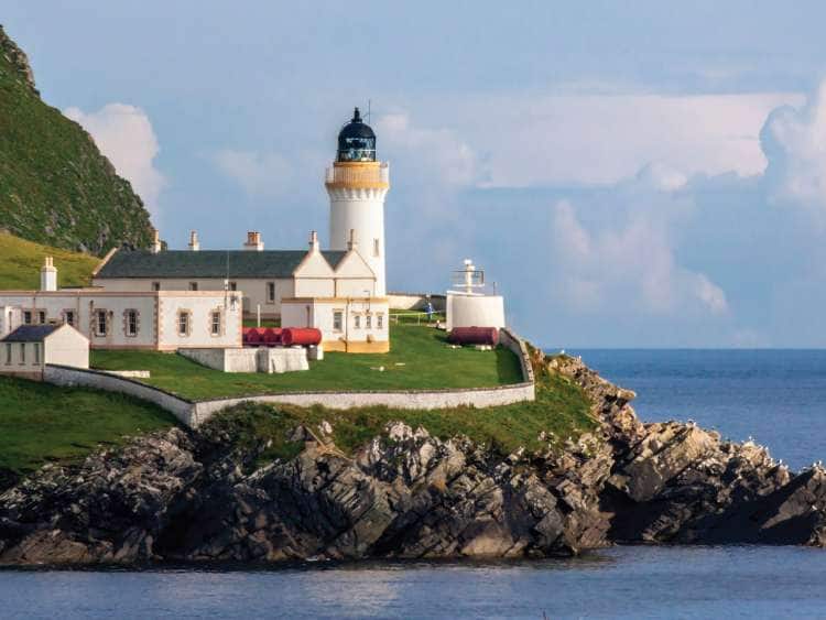 A lighthouse along the coast of Port Lerwick Shetland Islands