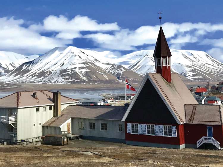 A view of a small town and church at Port Longyearbyen Norway