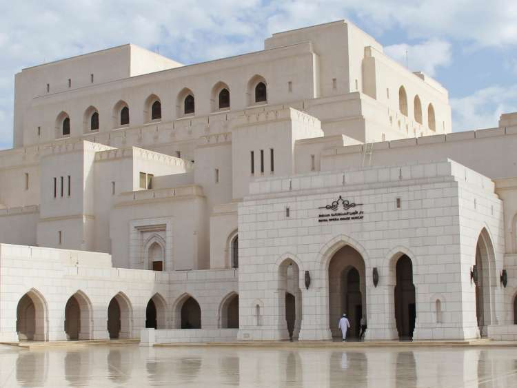 A large white building in Port Muscat Oman