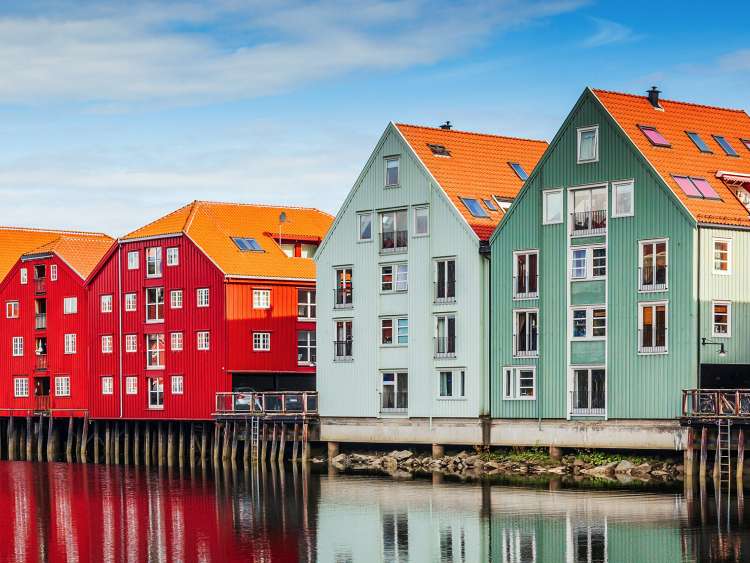 A view of the colorful houses along the coastline of Port Trondeim in Norway