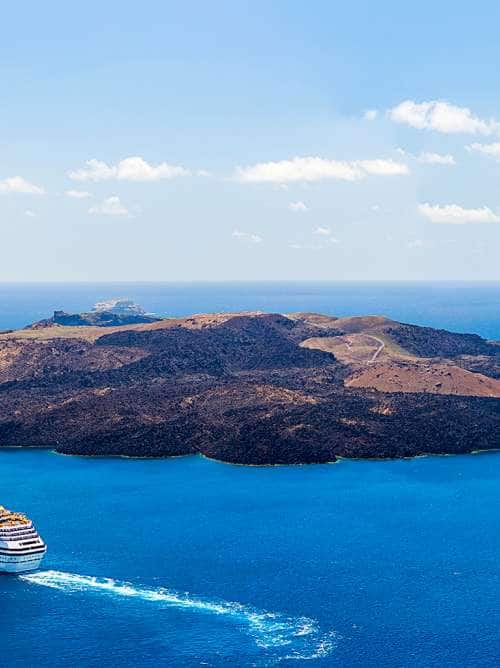 cruise ship sailing near Santorini, Greece