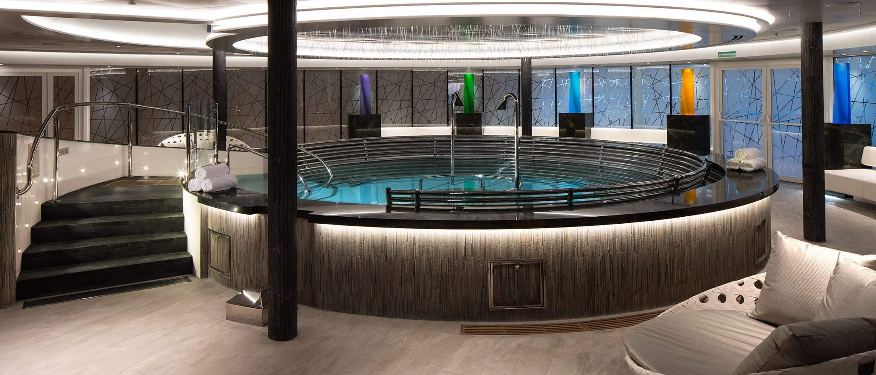 Hydropool in the spa featuring warm lighting and tranquil water elements on a Holland America cruise ship.