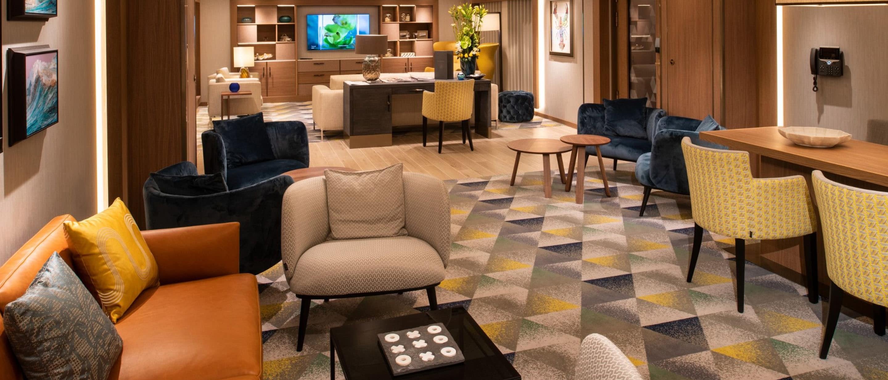 Exclusive Neptune Lounge onboard Holland America cruise ship cruise ship offering elegant seating.