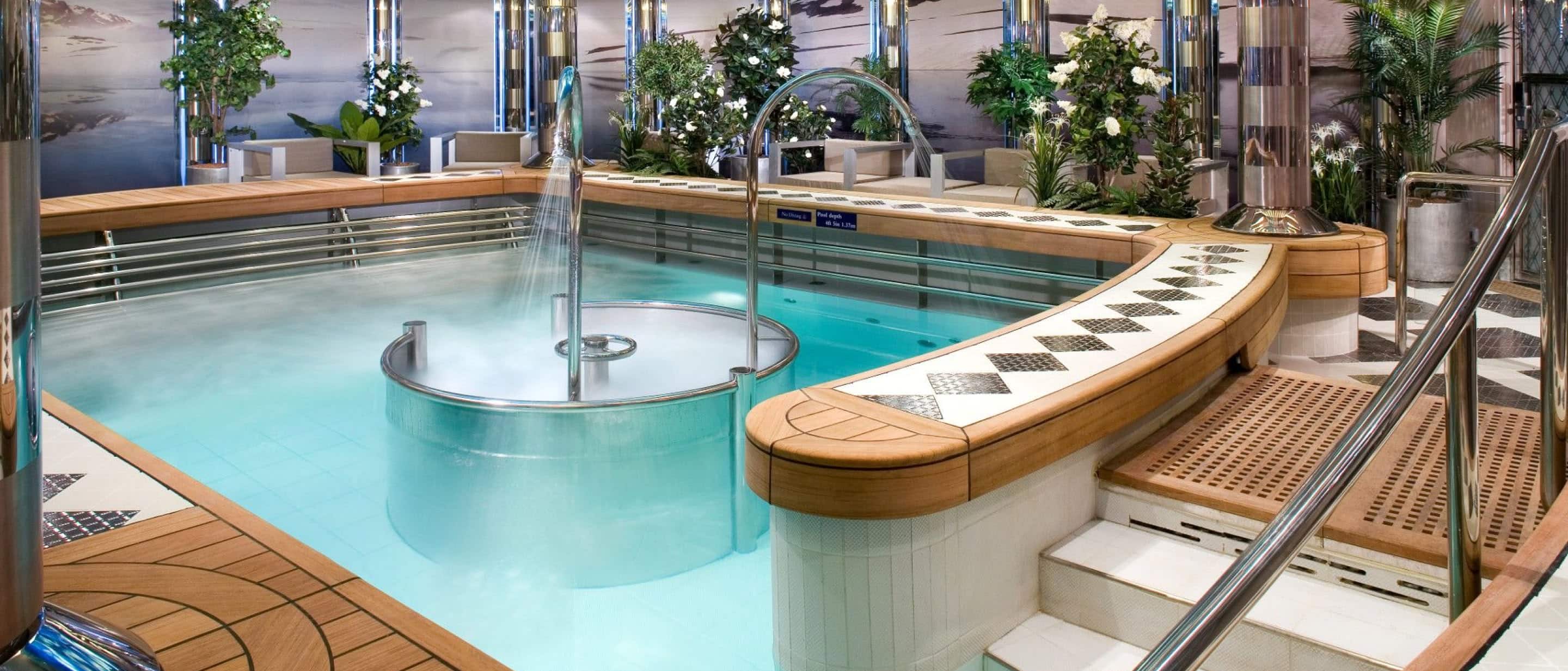 Hydropool in the spa featuring bright lighting and tranquil water elements on a Holland America cruise ship.