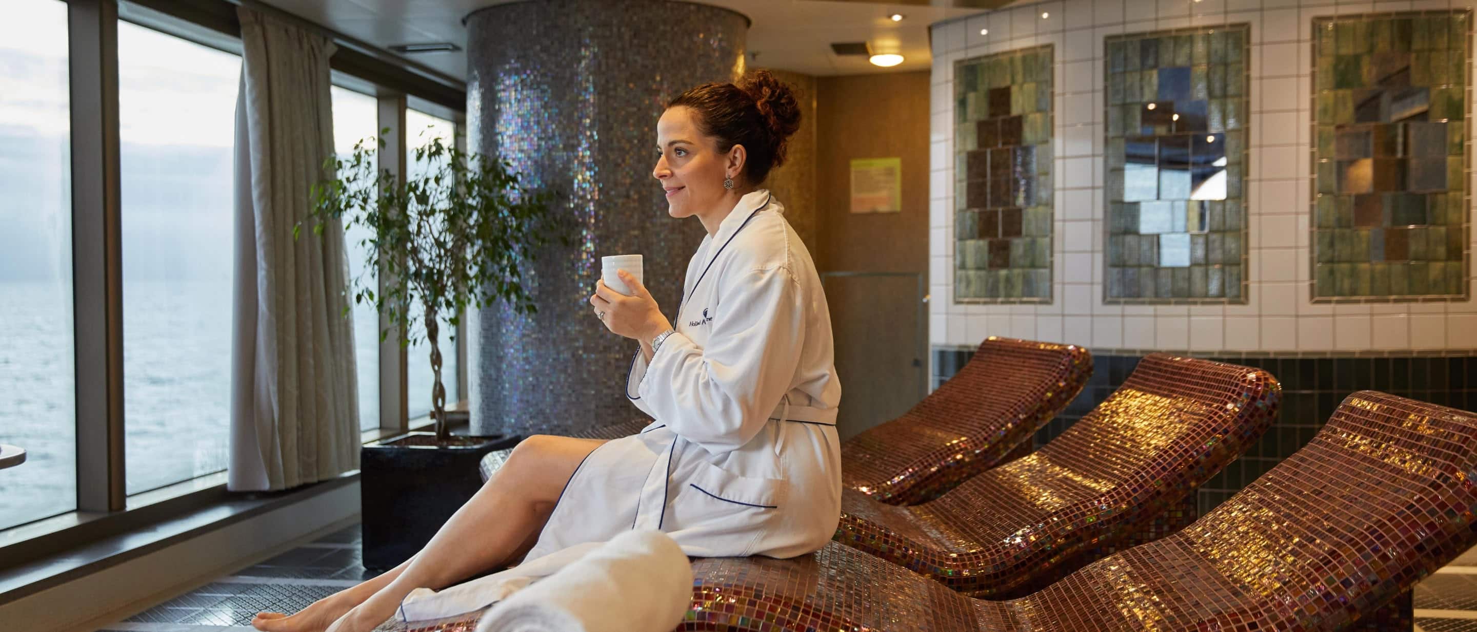 Lady having a moment of relaxation at the Greenhouse Spa on a Holland America Line cruise ship..