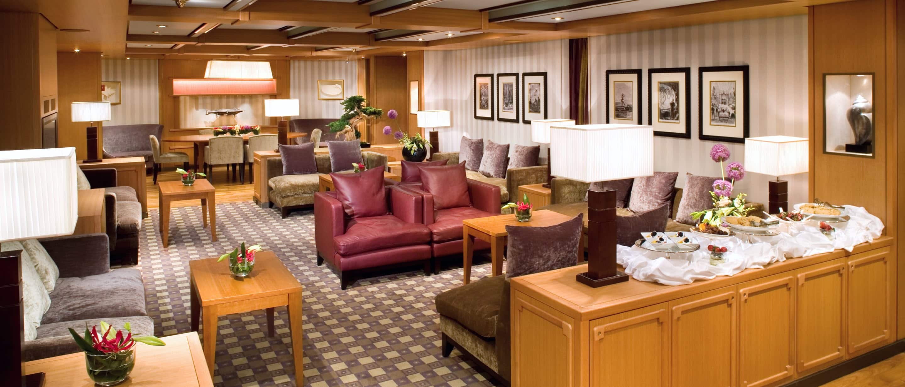 Exclusive Neptune Lounge onboard Holland America cruise ship cruise ship offering elegant seating.