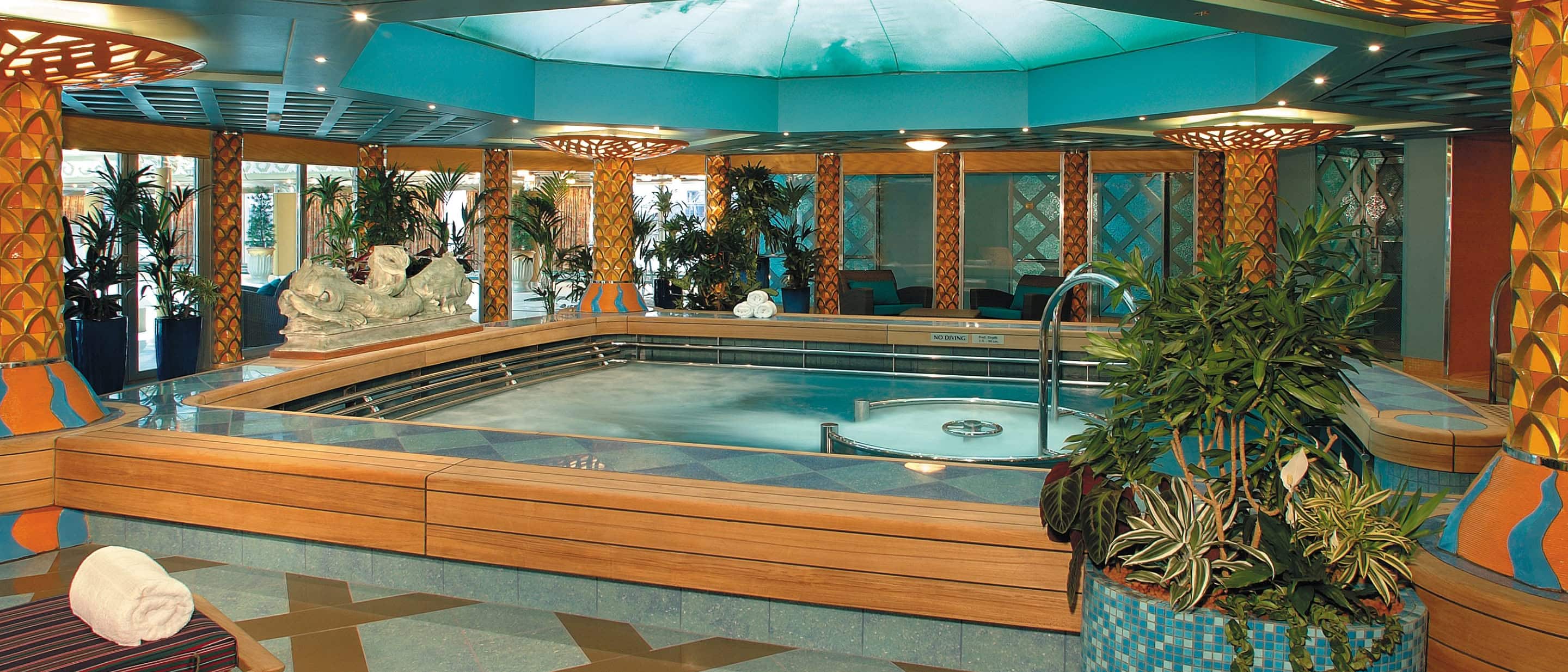 Hydropool in the spa featuring warm lighting and tranquil water elements on a Holland America cruise ship.