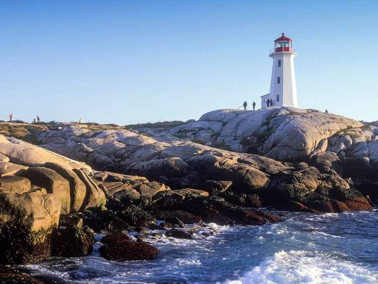 A picture of a lighthouse on a New England coast on a New England cruise